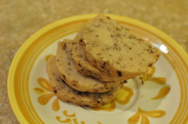 brown butter pecan shortbread slices on a round yellow floral plate