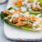 These Slow Cooker Buffalo Chicken Lettuce Wraps are super quick to get on the table. Slow cooker buffalo chicken, crisp romain leaves, celery, shredded carrot, blue cheese and ranch make a super quick, easy and healthy lunch or dinner. Perfect for meal prep.