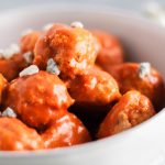 You NEED these Buffalo Chicken Meatballs for game day. Tender and spicy with a bite from the blue cheese.