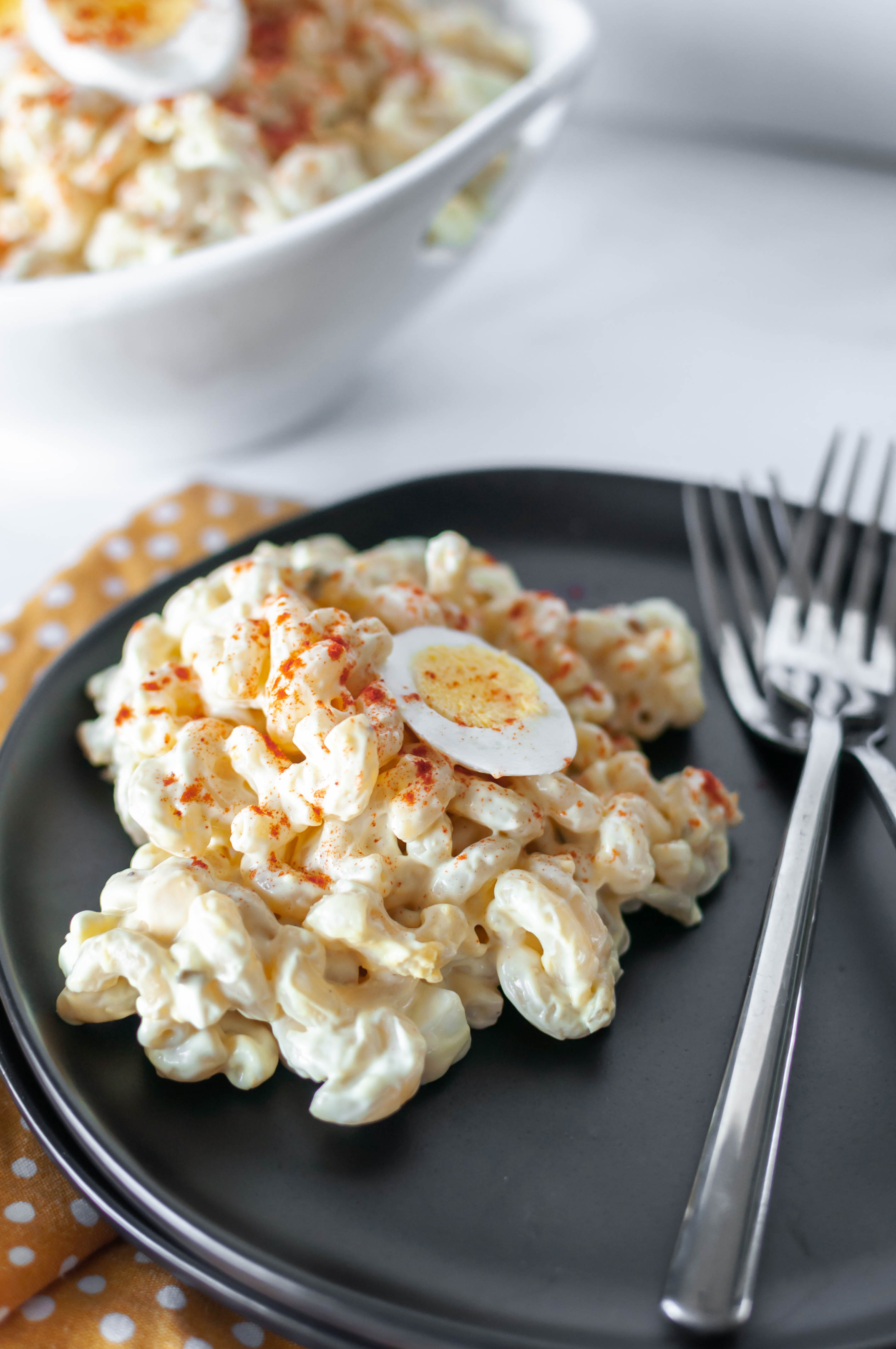 This Deviled Egg Macaroni Salad is perfect for all your summer gatherings. It’s creamy, loaded with hard-boiled eggs and super easy to make.