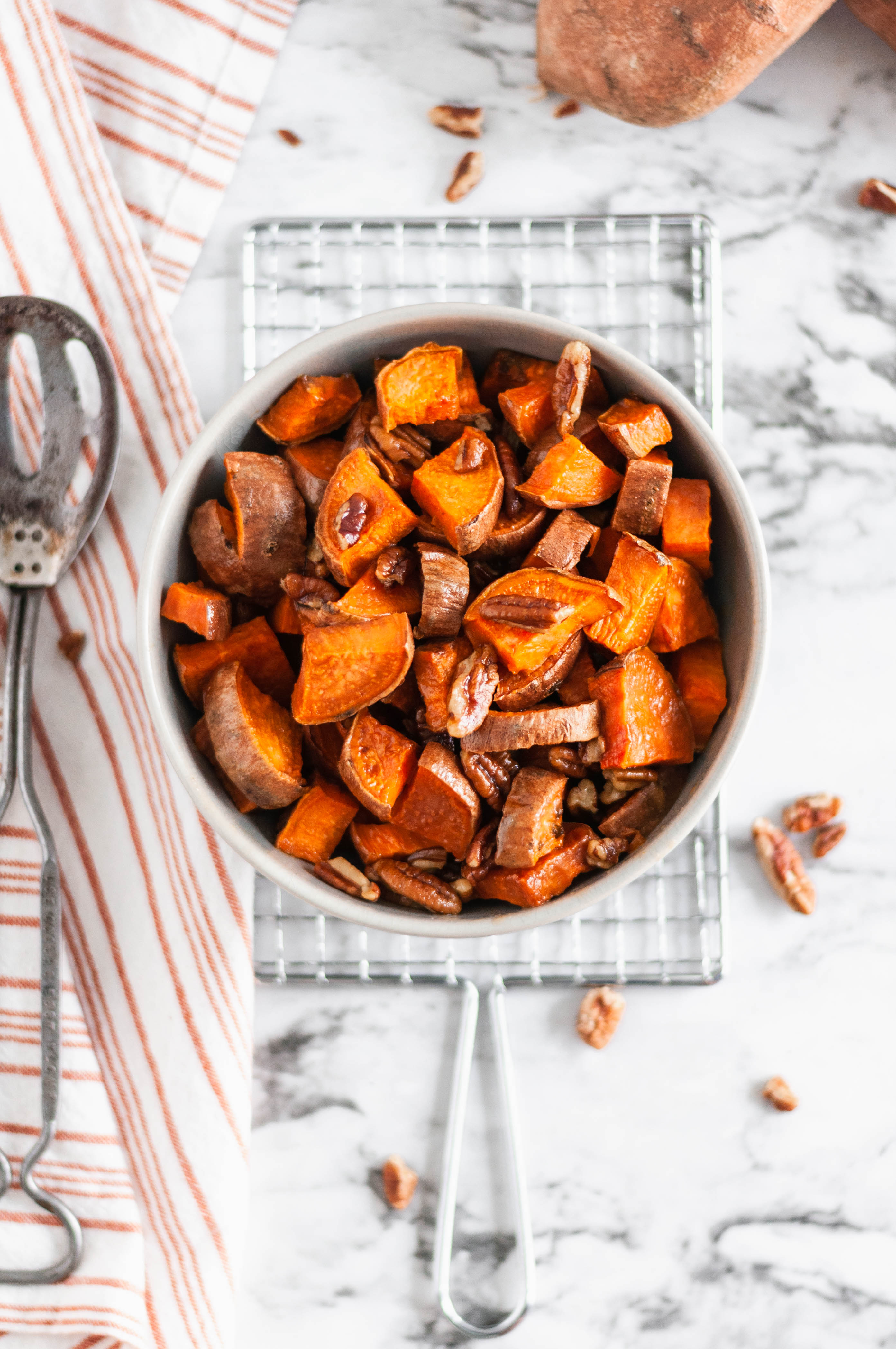 These Roasted Sweet Potatoes with buttery pecans are the perfect simple and easy side dish to add to your holiday menu. Less than 40 minutes from start to finish and you'll have sweet, tender, crunchy, buttery goodness on your dinner table.