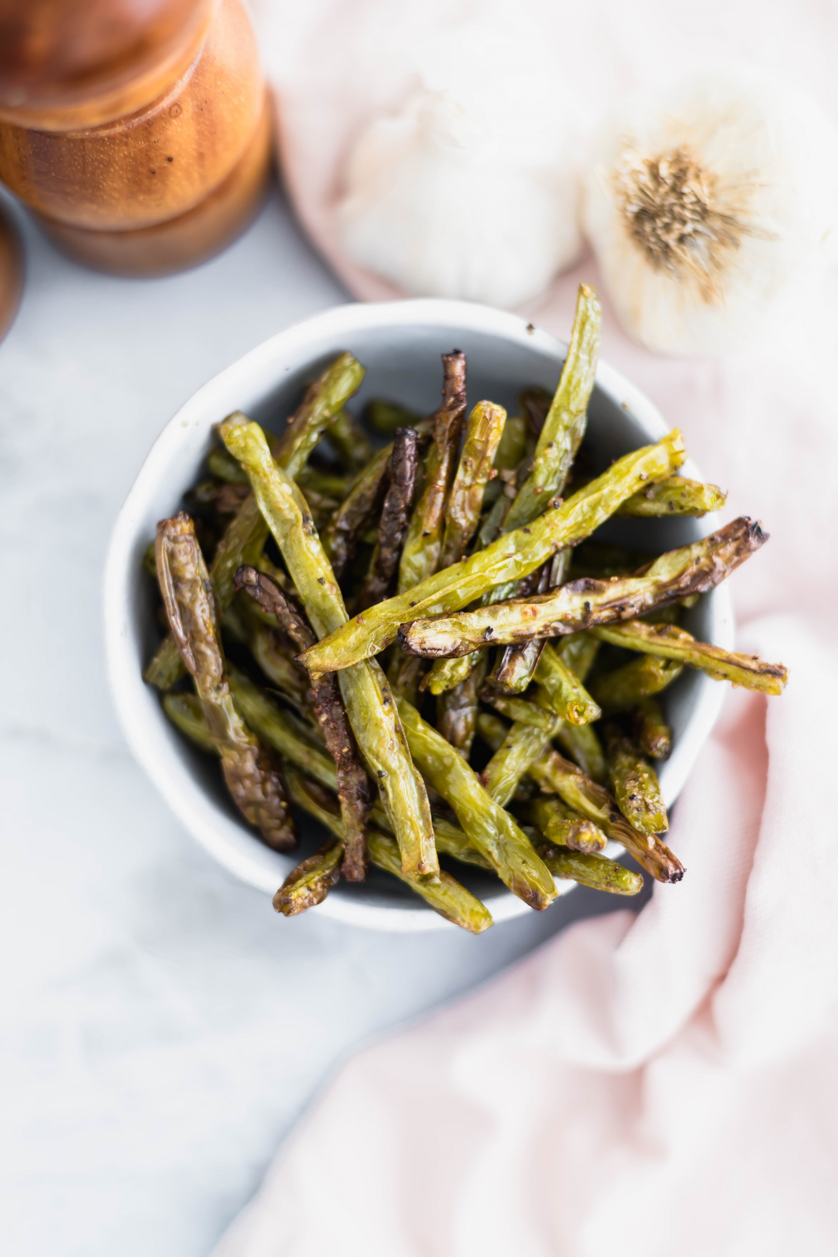These easy Roasted Green Beans make a super easy weeknight side dish. 20 minutes from start to finish. Use fresh green beans for the most amazing flavor.