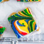 Rainbow Lemon Cheesecake Bars are a fun, festive way to celebrate St. Patrick's Day. Simple cheesecake is colored and swirled to make an adorable dessert.