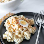 Deviled Egg Macaroni Salad is our favorite way to use up hard boiled eggs. It's packed with eggs and a delicious creamy sauce.