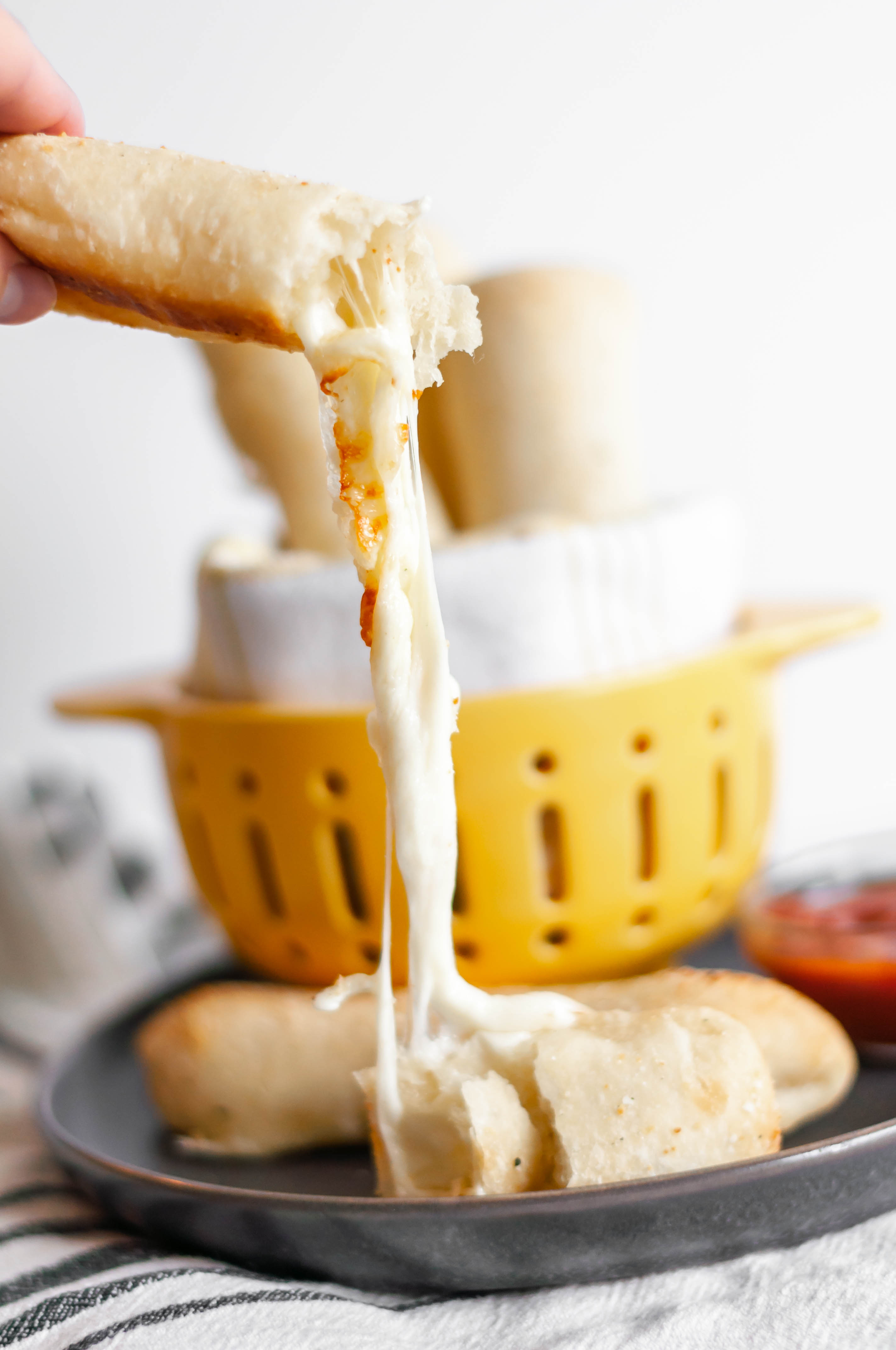 Cheese Stuffed Breadsticks are a super simple side for your soup or pasta this fall. Only 4 ingredients and less than 30 minutes for these ooey gooey cheese breadsticks.