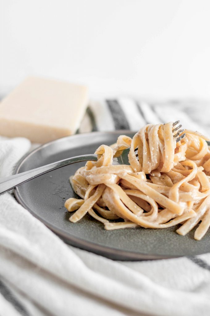 Roasted Garlic Alfredo will quickly become your go to weeknight meal. Garlicky, cheesy, nutty and done in less than 30 minutes.