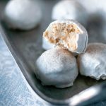 Snickerdoodle Balls are a fun spin on the classic Oreo Ball. Snickerdoodle cookies and cream cheese, dipped in white chocolate with a cinnamon sugar dusting