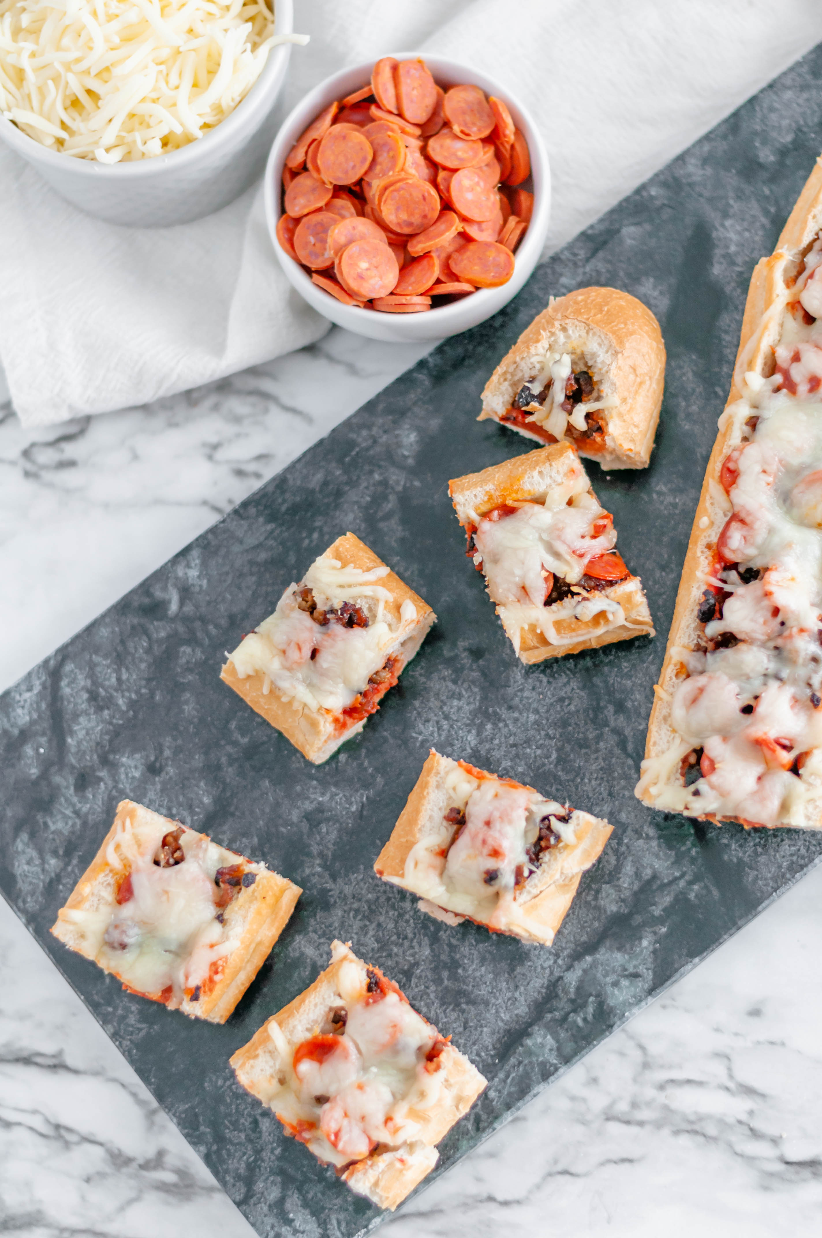 French Bread Pizza Bites make a simple appetizer with just a handful of ingredients. Perfect appetizer for the Super Bowl.