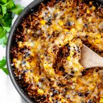 This Cheesy Mexican Skillet is done in 30 minutes for the perfect weeknight meal. Packed full of Mexican flavor from enchilada sauce, cumin, chili powder and more.