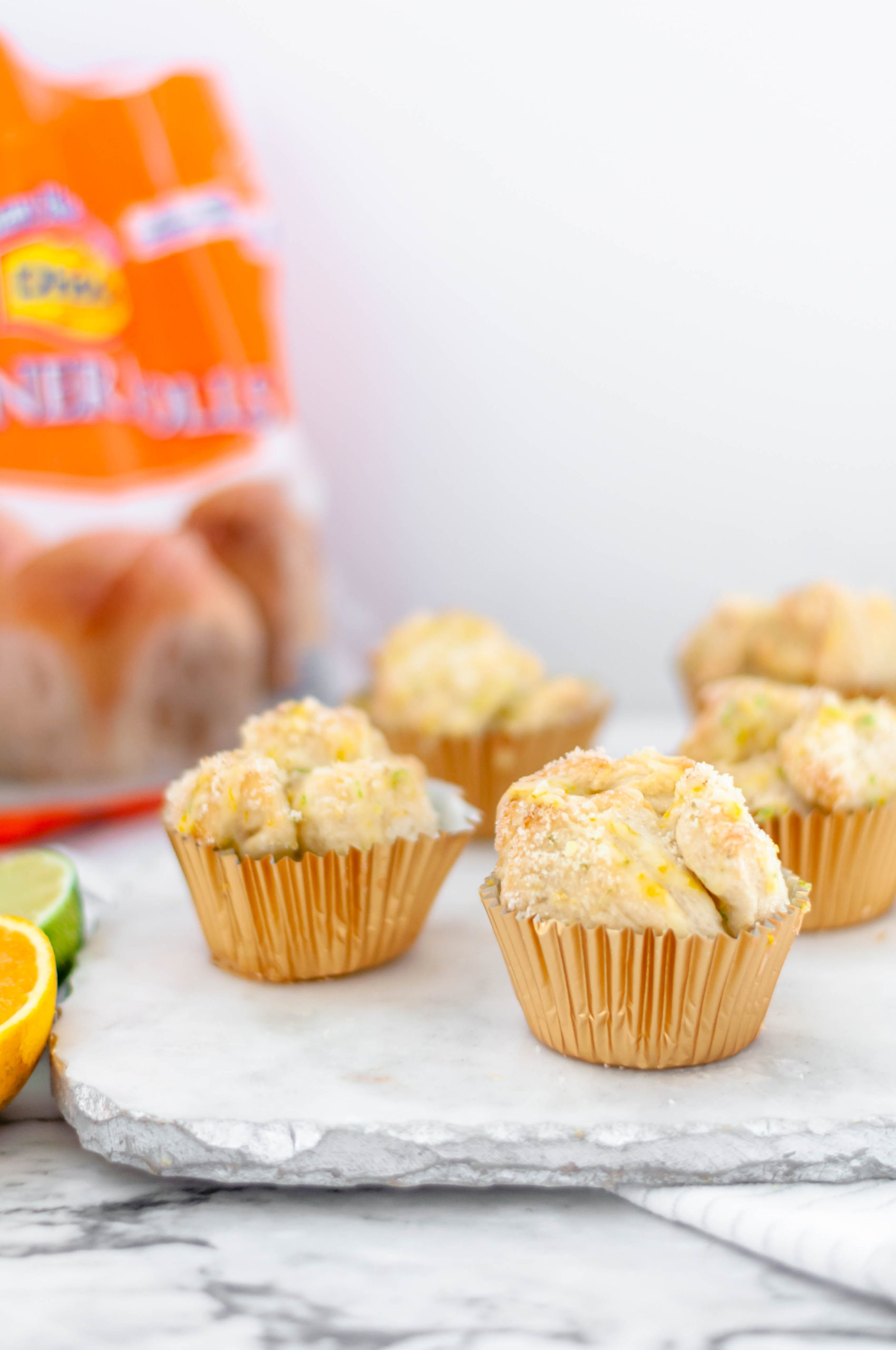 Grab a bag of Rhodes dinner rolls and transform them into these incredibly yummy Citrus Monkey Bread Muffins. Super simple to make and packed with flavor.