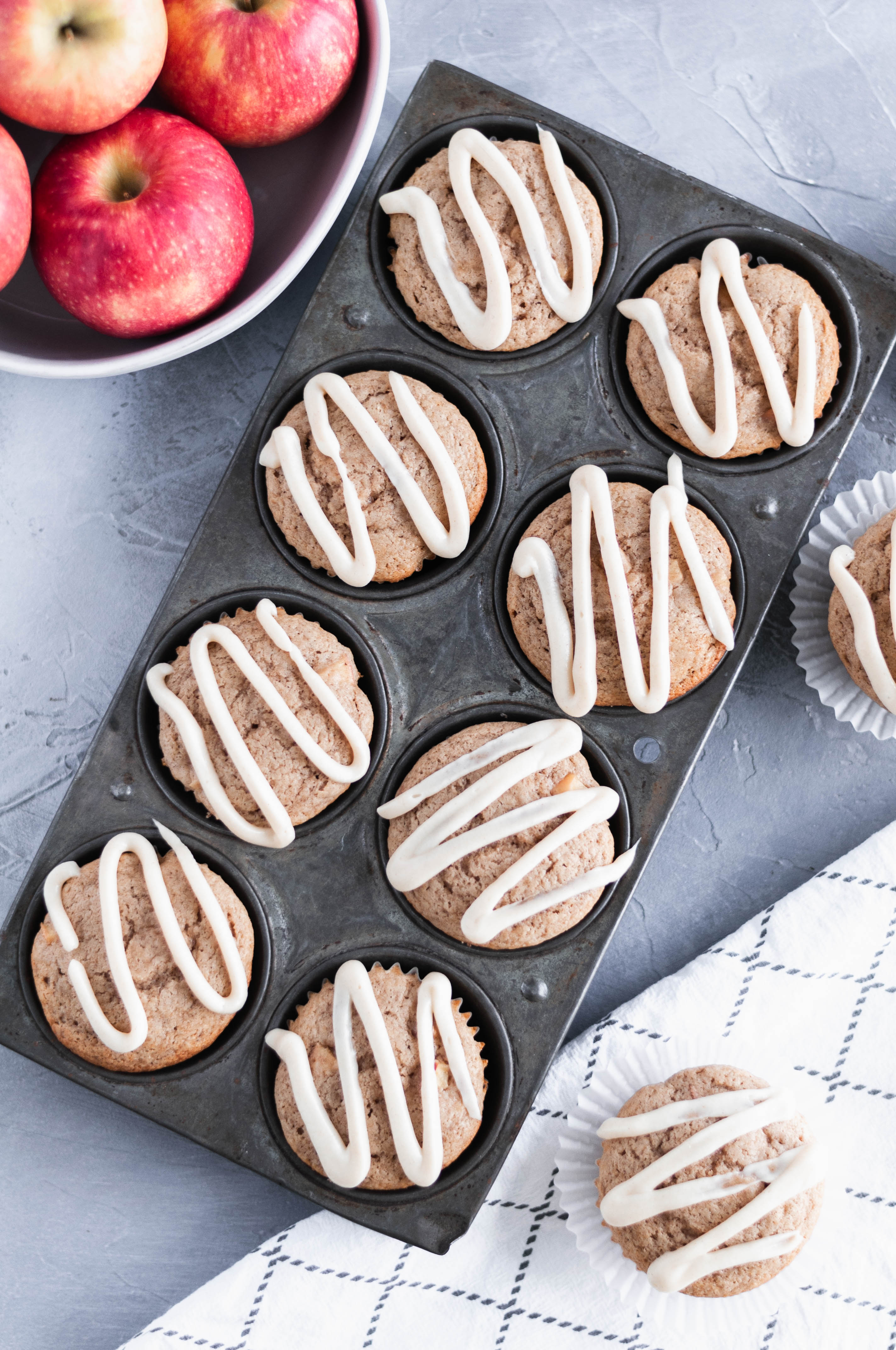 These apple muffins with cream cheese glaze are the perfect fall breakfast. Spice cake mix makes these simple to make and packed full of flavor. Grab your ingredients and get to baking.