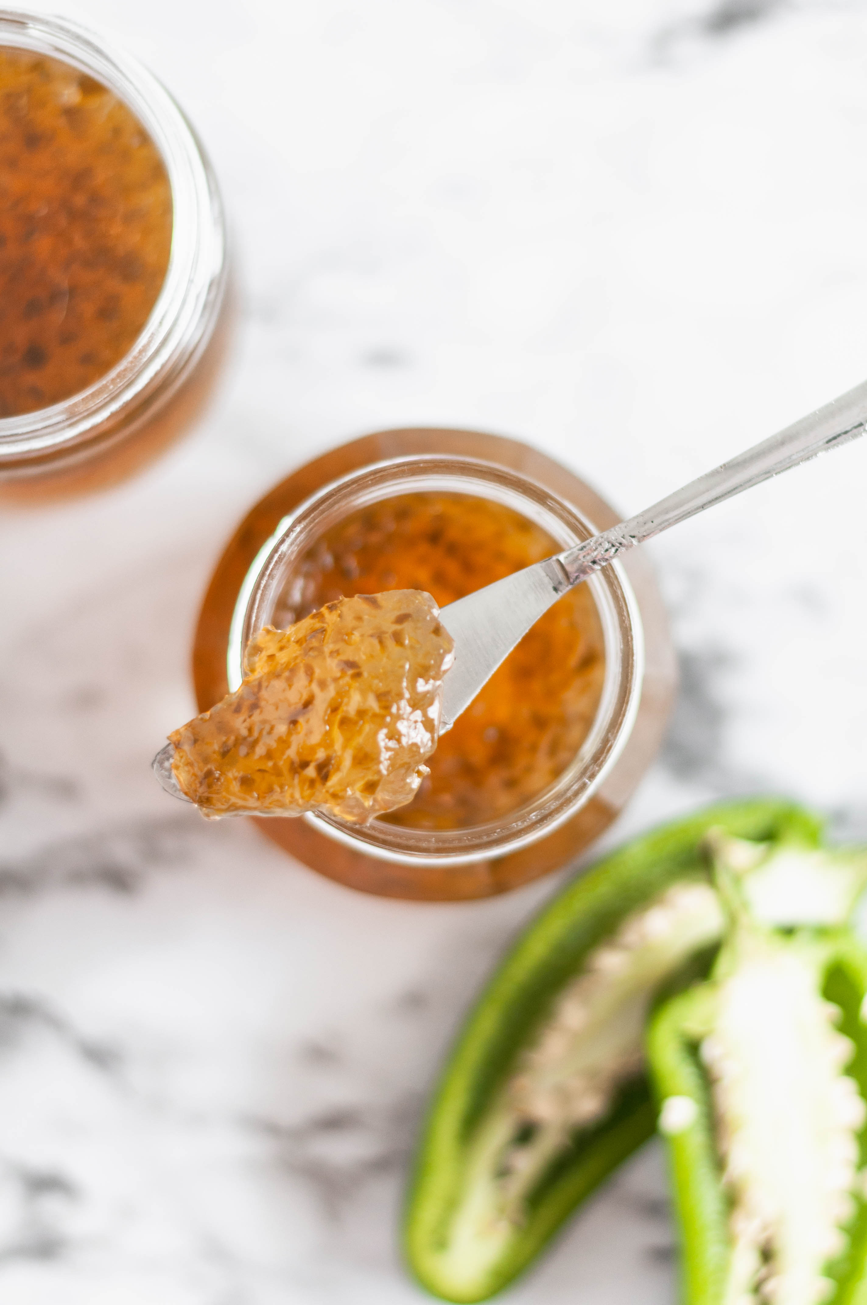 Homemade Jalapeno Jelly is easier than you would think and so delicious on all the things. Slather it on hot cornbread, a juicy burger or use it as a dip.