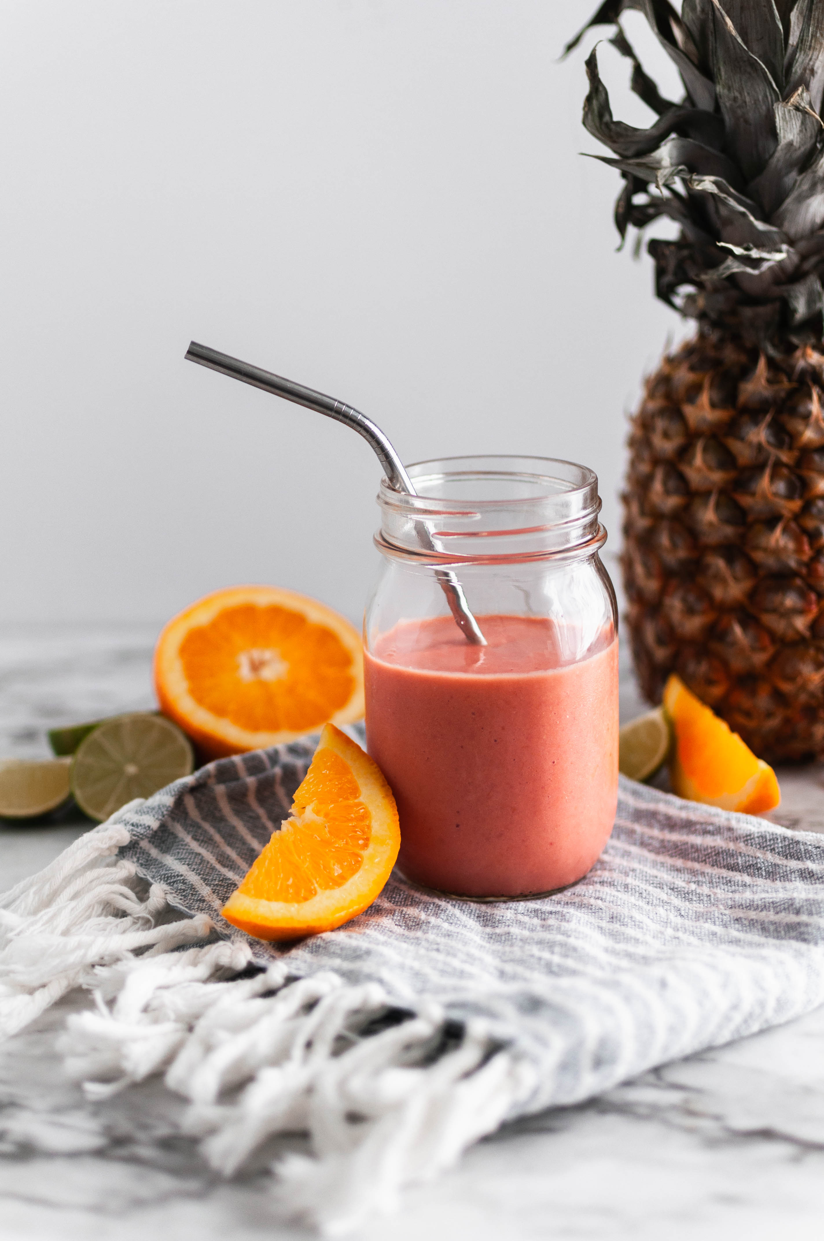 Get all the flavors of rainbow sherbet without all the sugar with this Rainbow Sherbet Smoothie. Fresh orange, lime juice, frozen raspberries and pineapple along with raspberry Greek yogurt all come together to make this incredibly fruity, healthy smoothie.