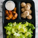 Salad Meal Prep is the perfect way to start out your New Year healthy. 45 minutes of prep results in a weeks worth of healthy and delicious lunches. Caesar dressing, homemade croutons and mini chicken meatballs add lots of flavor to the mix.