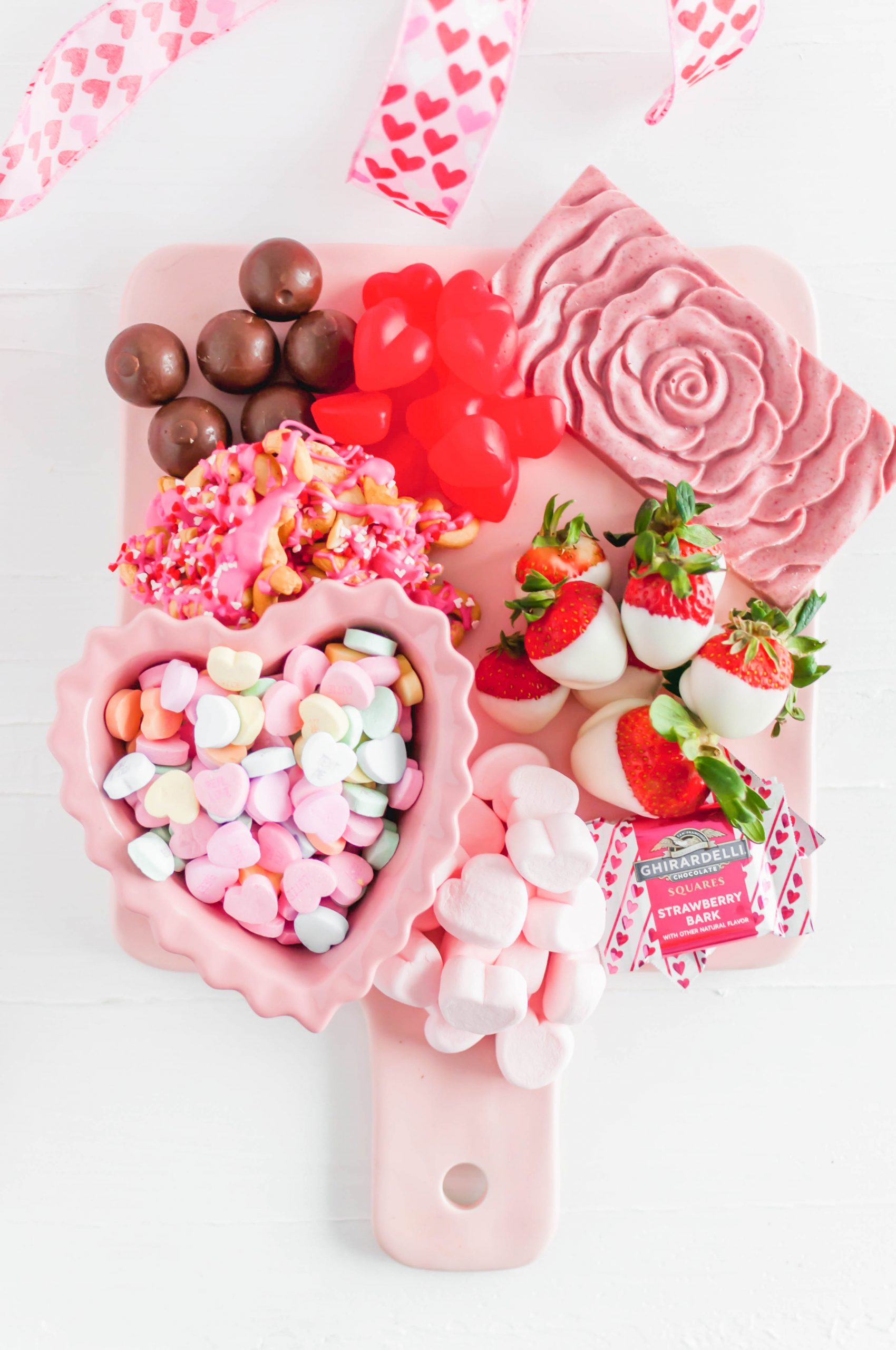 Keep your Valentine's dessert easy, fun, delicious and festive this year with this Valentine's Dessert Board. A few simple, homemade treats mixed in with some adorable store-bought options.