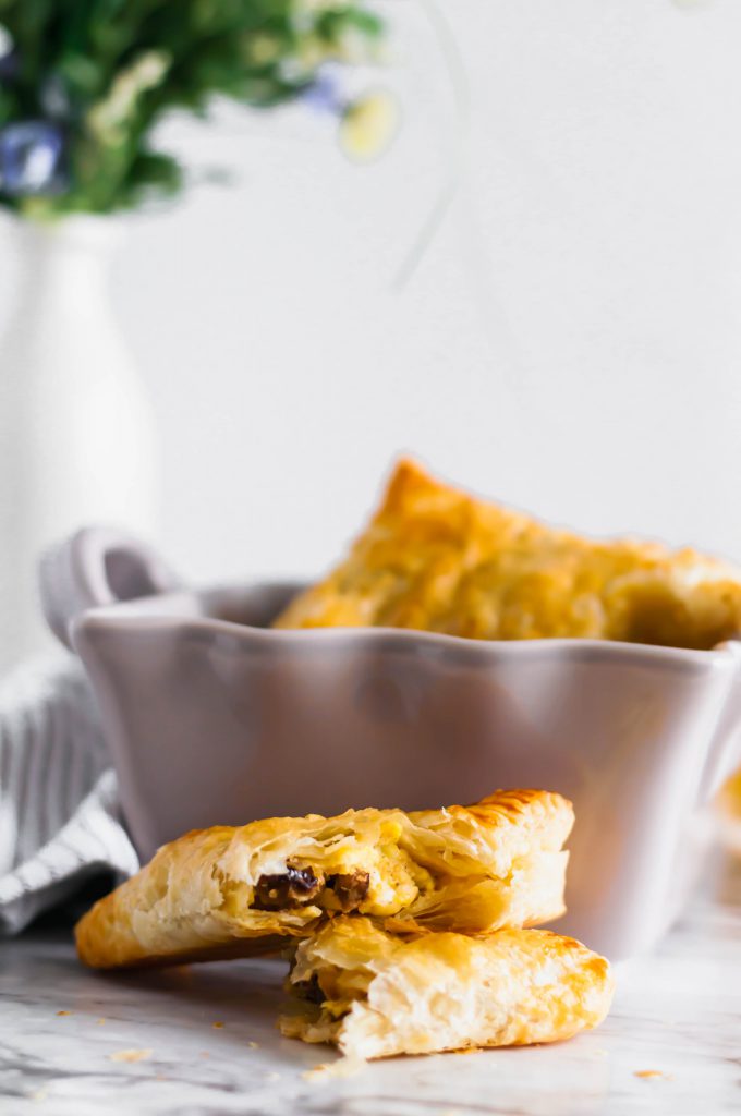 These Savory Turnovers are going to turn into your favorite brunch item. Flaky puff pastry filled with tender scrambled eggs, breakfast sausage and shredded sharp cheddar.