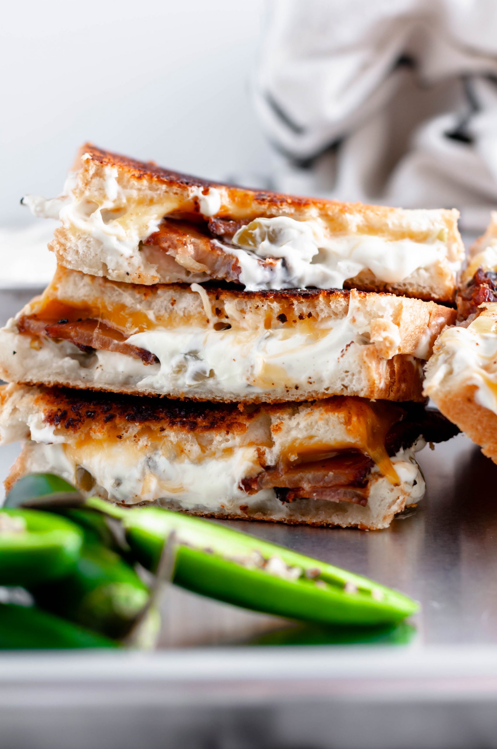 Meet your new favorite sandwich, the Jalapeno Grilled Cheese. Jalapeno jelly, cream cheese, pickled jalapenos, sharp cheddar and bacon combine to make the most glorious sandwich around.