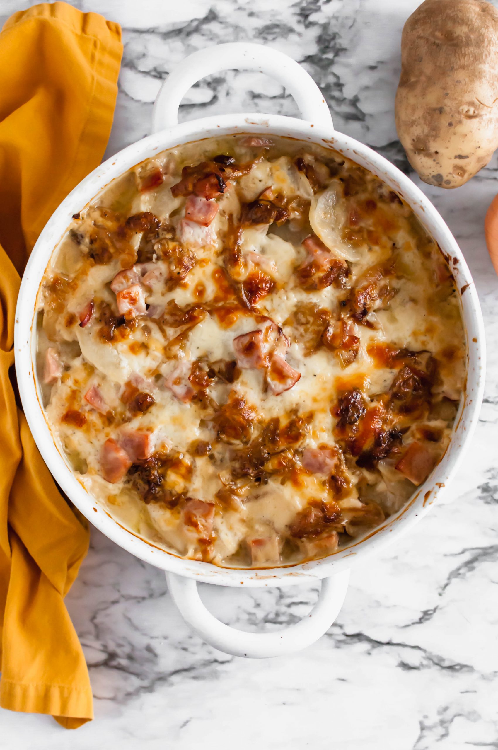 These Scalloped Potatoes with Ham are the perfect side dish for Easter or after to use up your leftover ham. The addition of caramelized onions add amazing flavor.