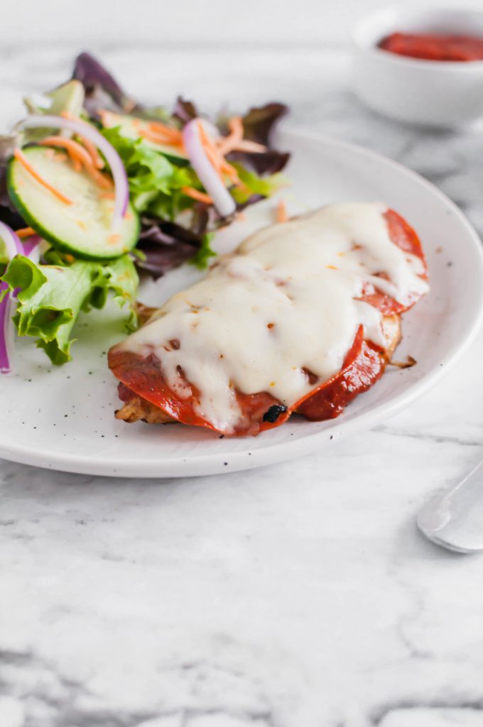 This Pizza Chicken is sure to be a new family favorite. Marinated chicken, grilled to perfection and topped with the best pizza toppings.