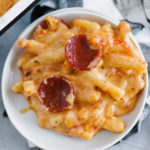 Two American favorites combine to make the most glorious Pizza Macaroni and Cheese. Creamy, cheesy pasta topped with pizza sauce, pepperoni and more cheese. Customize it and use your favorite toppings.