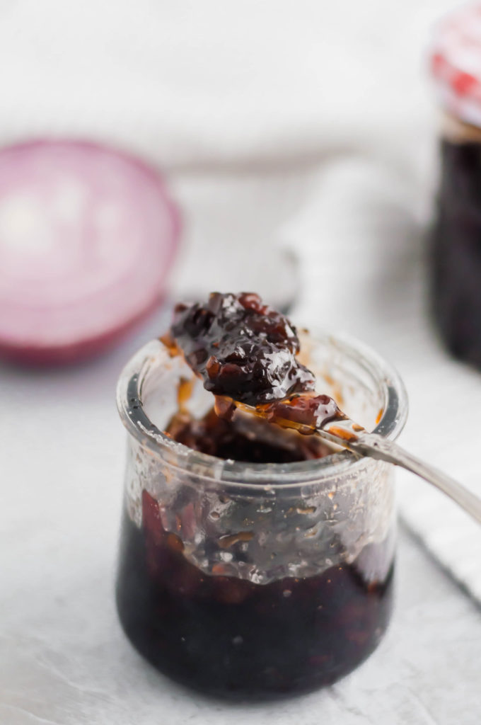 Bacon Onion Jam is a delicious, sweet and savory condiment that is going to blow your mind. Smoky bacon, red onions, sugar and vinegar are cooked down to create a thick, caramelized jam that is delicious on crackers, sandwiches, brie and more.