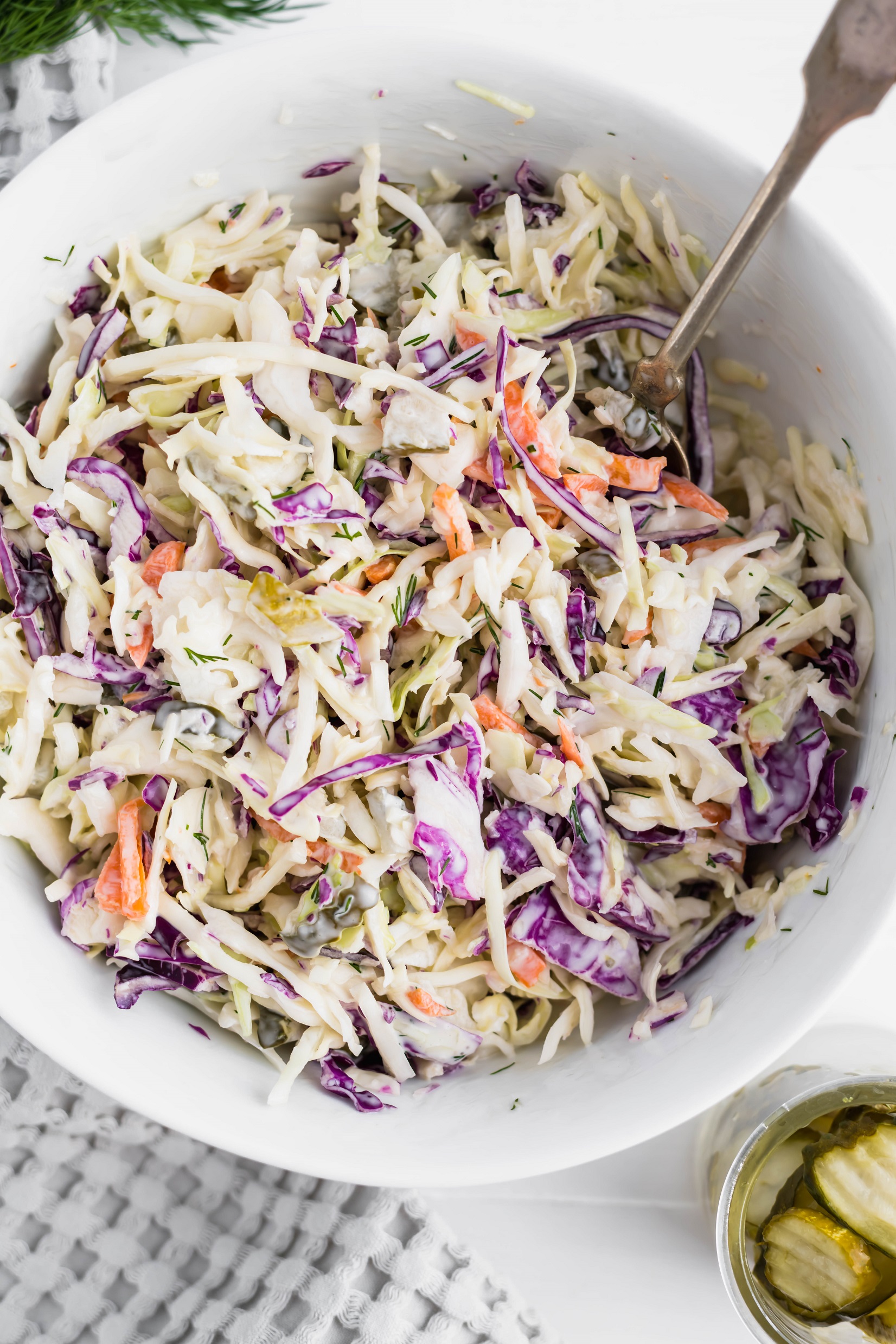Change up your classic coleslaw with this Dill Pickle Coleslaw. Creamy dressing spiked with pickle juice, chopped pickles and fresh dill brings all the pickle flavor.