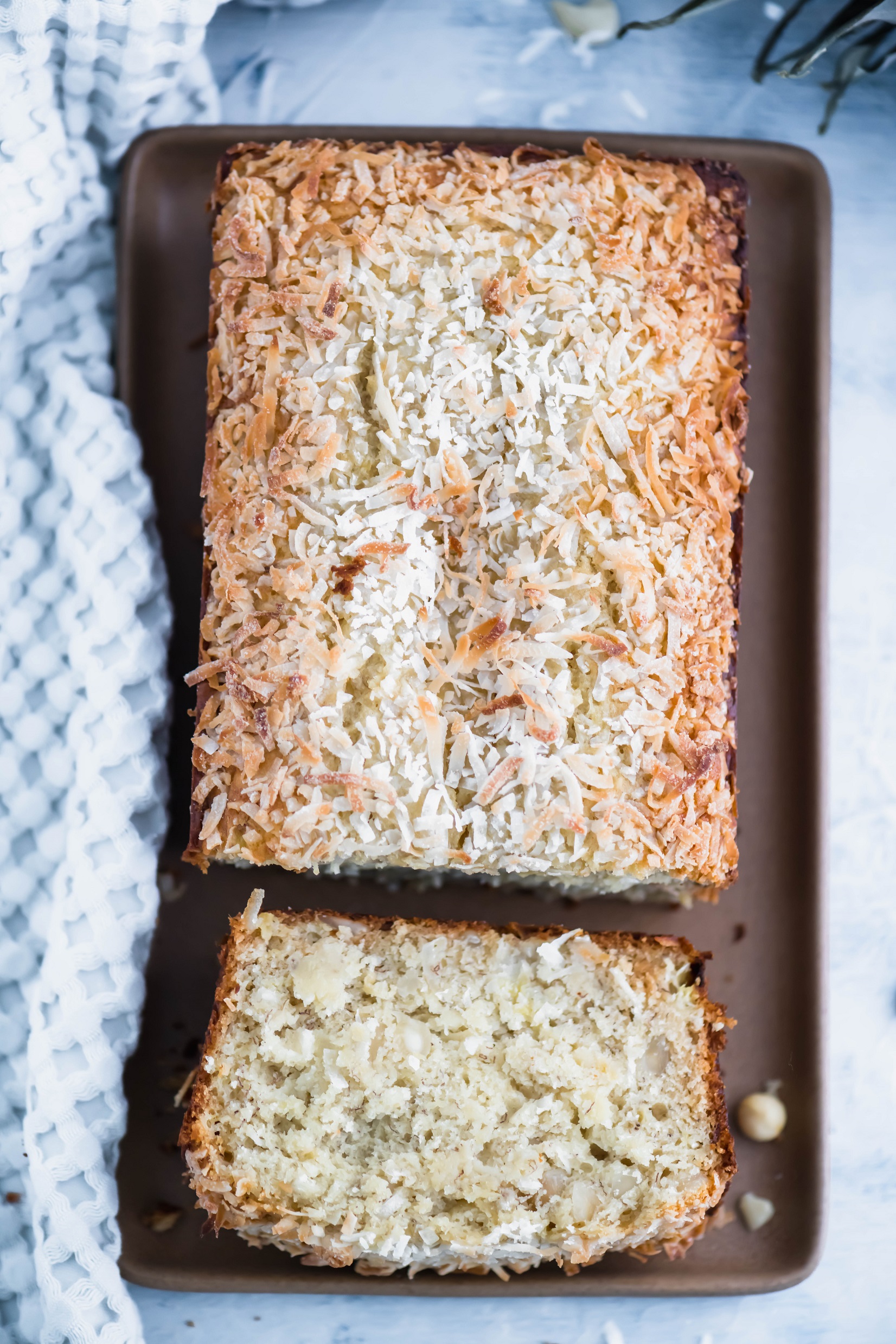 We're upgrading the standard banana bread today with delicious Hawaiian ingredients. This Hawaiian Banana Bread is packed with pineapple, macadamia nuts and coconut for all the tropical vibes.