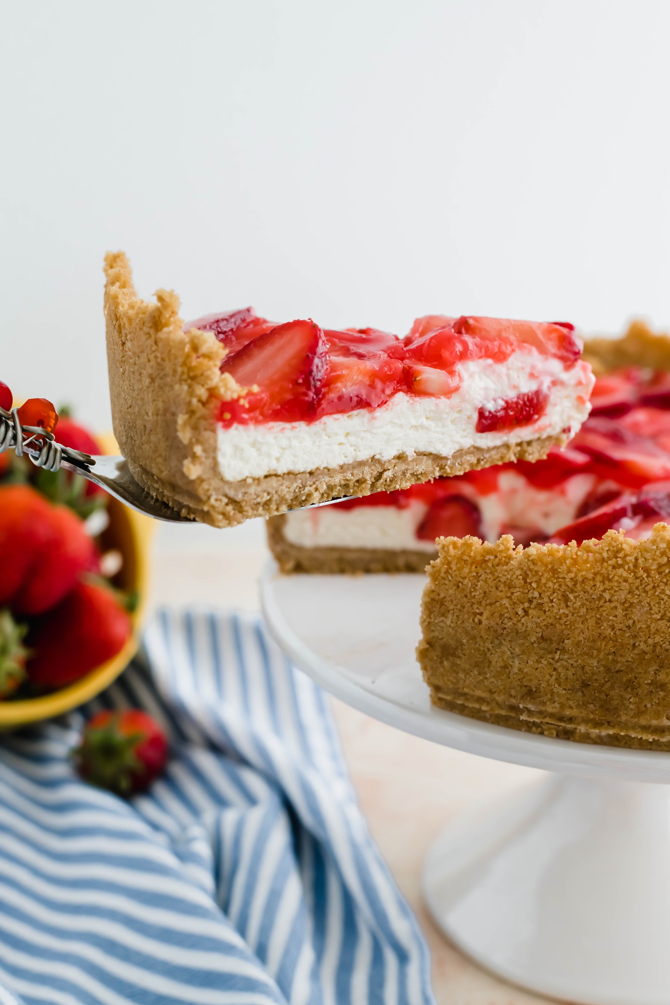 I combined two favorite summer desserts, cheesecake and strawberry pie, to make the most delicious treat, Strawberry Cream Cheese Pie. A fluffy, no-bake cheesecake filling topped with classic strawberry pie filling will have you addicted in no time.